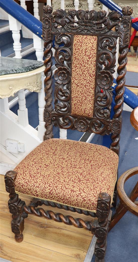 A pair of carved oak barleytwist chairs